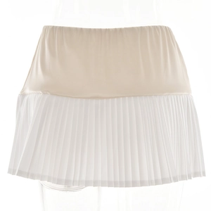 Detail showing the beige and white patchwork design on this pleated mini skirt