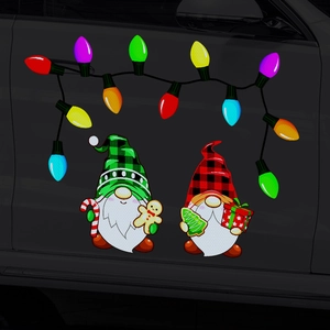 Close-up of reflective Christmas gnome magnets and colorful light bulb decals on a dark car door