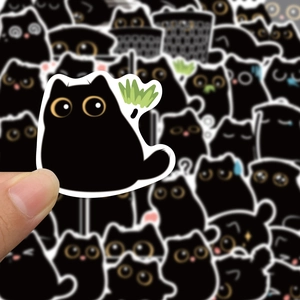 Close-up of cute cartoon soot sprite stickers with funny expressions for DIY decor