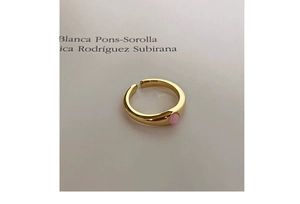 Detail of s925 silver gold-plated ring featuring a pink opal and adjustable band