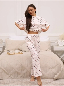Cozy two-piece pajamas with red heart prints featuring short-sleeve top and elastic pants