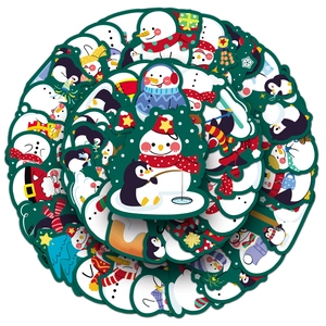 Close-up of assorted Christmas snowman and penguin stickers with vibrant winter designs
