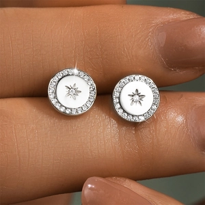 Macro detail of S925 sterling silver geometric stud earrings with tiny pavé zircon stones