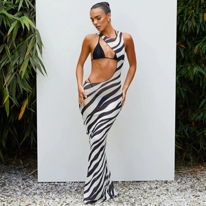 Detail view of zebra print sheer mesh cover-up dress over a black halter bikini set