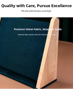Close-up of premium blue velvet and natural wood texture on jewelry display stand