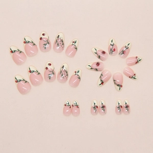 Detail view of 24pcs almond press-on nails with 3D ladybug and strawberry floral patterns