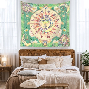 Detail view of Bohemian tapestry featuring sun, moon, and zodiac symbols in a cozy bedroom