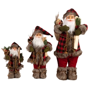 Three plush Santa Claus figures in red plaid outfits with skis in various sizes