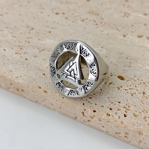 Vintage stainless steel men's ring featuring Valknut Nordic symbol on travertine stone background