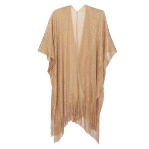 Detail shot of the golden metallic knit texture and long tassel fringe of this shawl