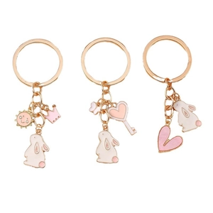 Cartoon bunny heart keychains with gold rings and pink enamel charms for backpacks