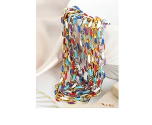 Detail of colorful enamel segments on gold and silver plated titanium steel chain jewelry