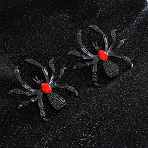 Detailed view of Gothic black spider earrings with red gemstone and crystal rhinestones