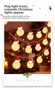 Close-up of LED Christmas snowman lights with red hats on a festive background