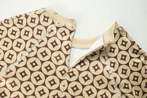 Macro detail of seamless neckline and invisible zipper on geometric print jumpsuit