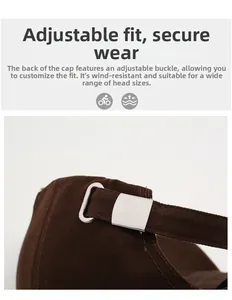 Detail of adjustable silver metal buckle on dark brown cotton twill baseball cap