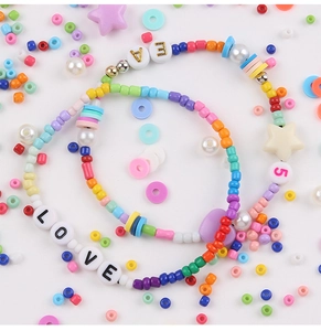 Detail of colorful rainbow seed bead bracelets with LOVE letter beads and star charms