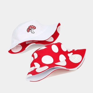 Reversible bucket hat with cute mushroom embroidery and red polka dot pattern for sun protection
