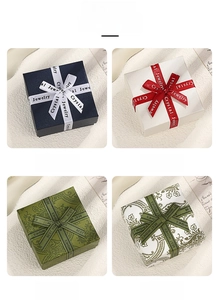 Detailed views of four elegant square jewelry gift boxes with bow ribbons in various styles