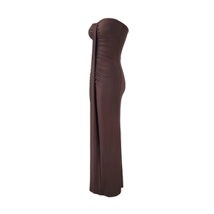 Detail view of the side ruching on a slim-fit dark brown tube maxi dress