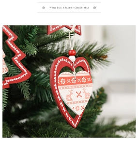 Close-up of Nordic wooden Christmas ornaments with reindeer and snowflake patterns