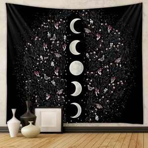 Detail of bohemian black moon phase tapestry with moth and botanical moth patterns