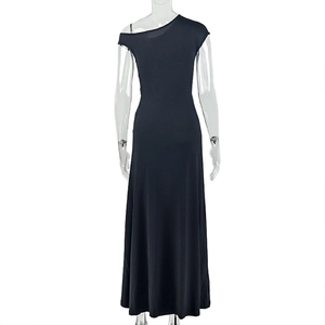 Detail of black one-shoulder maxi dress featuring elastic knit fabric and waist ruching