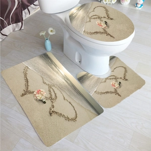 Three-piece bathroom mat set featuring romantic beach heart sand and floral print