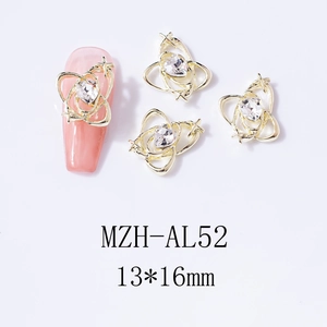 Macro view of gold heart Saturn nail charm with crystal inlay on pink false nail