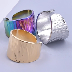 Modern hammered wide band rings in gold silver and iridescent purple metal finishes