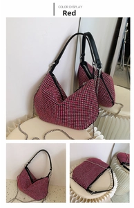 Close-up of bright pink hobo bag with sparkling rhinestones and silver chain strap
