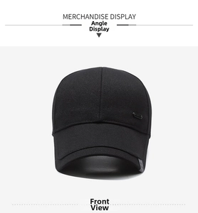 Close-up of black baseball cap with metallic logo and durable twill fabric texture