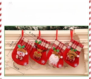 Detail of Christmas stocking ornaments showing snowman elk and bear 16cm height dimensions