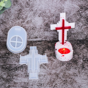 Detail of 3D cross silicone mold set with finished resin candle holder on stone background