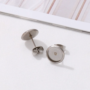 Macro shot of silver stainless steel round stud earring blanks for DIY jewelry making
