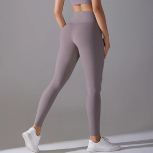Rear view of high-waisted lavender yoga leggings showing seamless push-up lifting effect