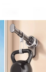 Detail showing strong load-bearing capacity of the wall-mounted suction cup hanger with kettlebell