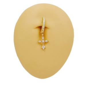 Golden cross pendant belly button ring with sparkling zircons on skin-toned model