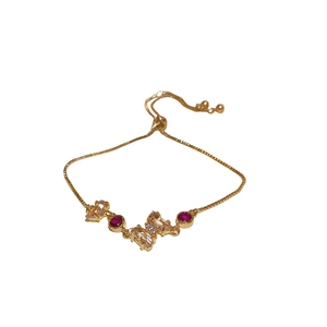 Bracelet papillon doré ajustable avec pierres de zircon champagne et rouges