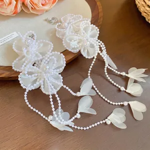 Elegant white chiffon flower earrings with long pearl tassels and floral accents
