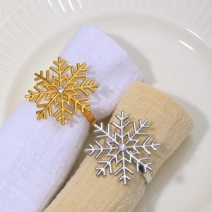 Golden and silver alloy snowflake napkin rings with rhinestones for festive table setting