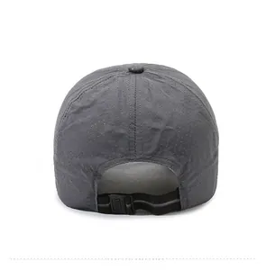 Detail view of the breathable mesh texture and adjustable strap on the dark grey baseball cap