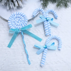 Blue and white knitted Christmas lollipop ornaments set with velvet bows for tree decor