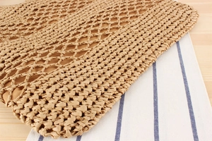 Detail of hollow paper rope woven bag showing natural texture and soft cotton lining
