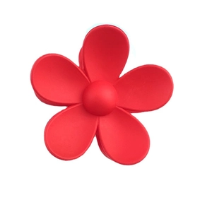 Matte red flower hair claw clip with a minimalist five-petal floral design and strong grip