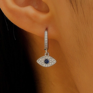 Detailed view of evil eye hoop earring with blue zircon and micro-pave silver stones