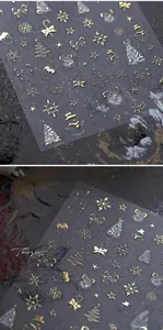Detail of golden 3D embossed Christmas nail stickers featuring snowflakes and stars