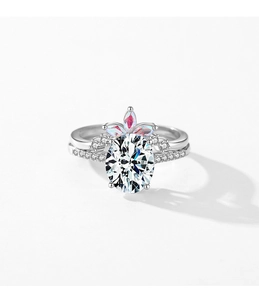 Macro shot of S925 silver wedding set with oval centerpiece and crown-shaped accent ring