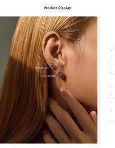 Detail showing 5mm and 6mm sapphire blue firework-cut S925 silver stud earrings
