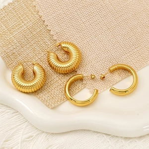 Golden vintage hollow C-shaped hoop earrings with croissant texture and smooth finish